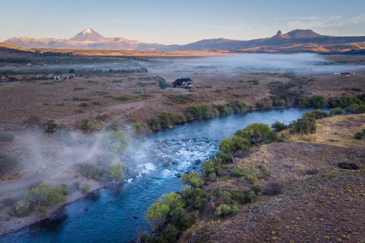 The Río Chimehuin flows beneath Volcan Lanín near Junín de los Andes