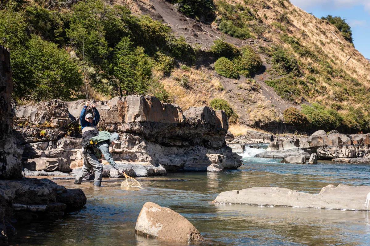 Rio Simpson Magic Waters guide Hayden nets a Rio Simpson rainbow trout in the pocket water at the base of the canyon