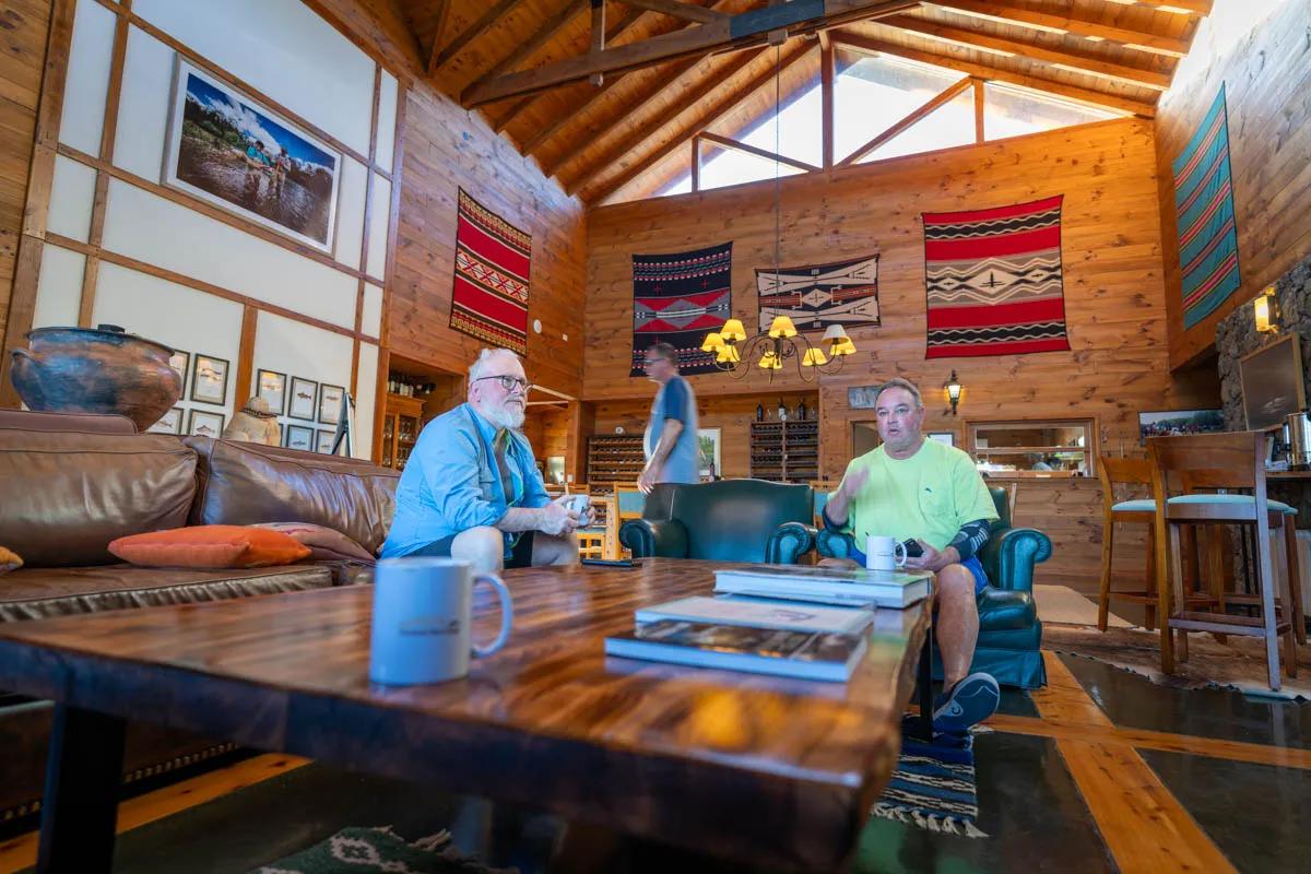 Guests relax in the great room at Carrileufu River Lodge during Montana Angler's 2024 hosted trip. Guests relax in the great room at Carrileufu River Lodge during Montana Angler's 2024 hosted trip.
