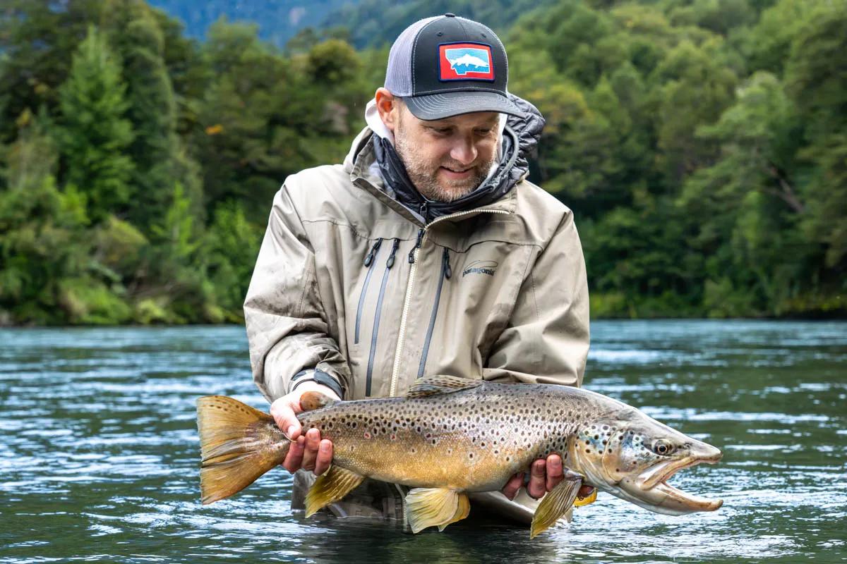 Ben Pierce admires a 28-inch Río Blanco brown trout caught on the last cast of the day.