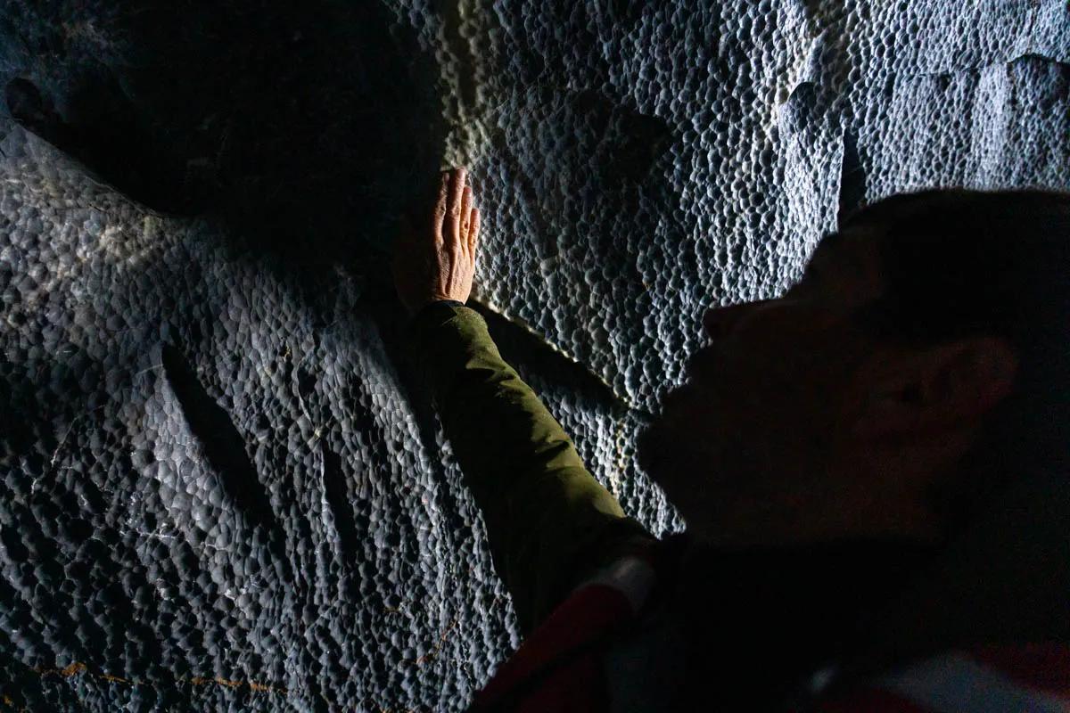 Wind and water have formed polished facets on the marble within the caves.