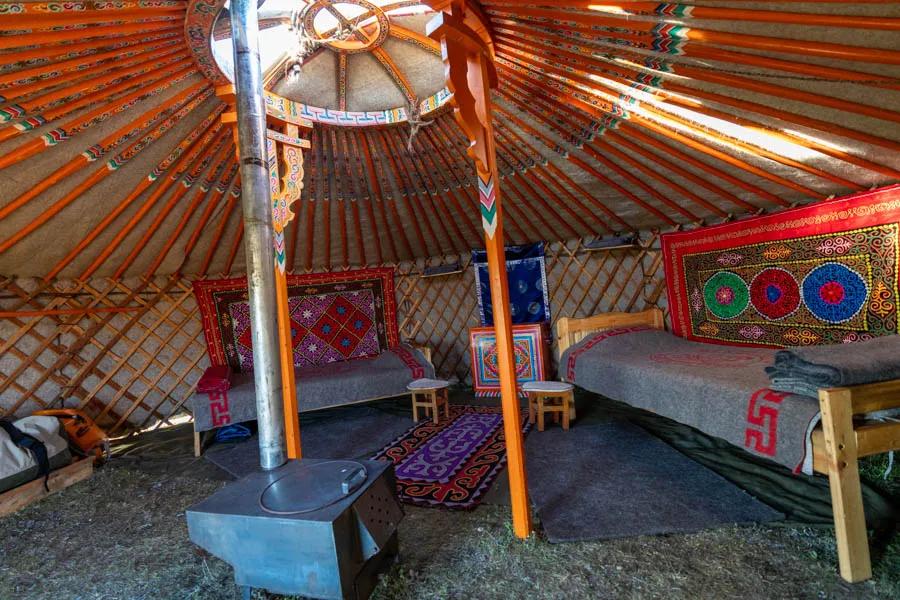 Mongolian ger camp Each sleeping ger had a wood buring stove, two twin XL platform beds with pillows and woold blankets as well as traditional Mongolian tapestries