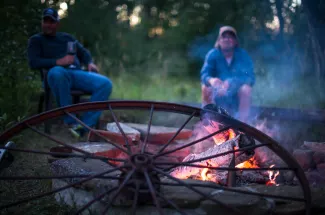 Warming up by the campfire