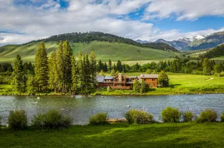 Fishing lodge on the river bank