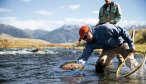 holding fish on madison river