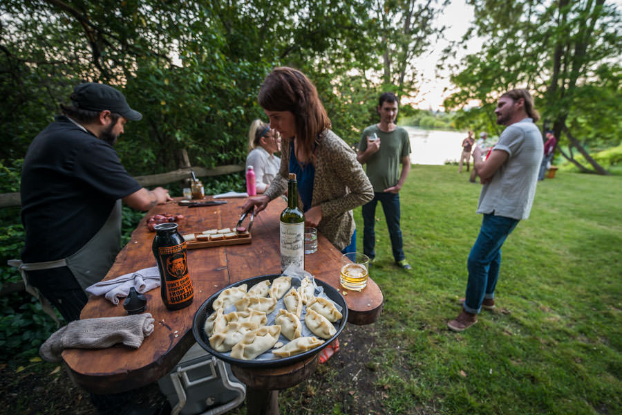 Chef "Pinky" prepares some appetizers along the river including empanadas and chorizo