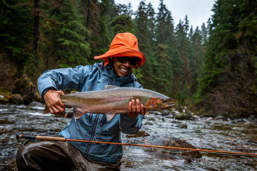 Fresh run wild steelhead have few equals in these small streams. They don't come to the net easily but they are always worth the effort. Chris with her first steelhead on a fly rod